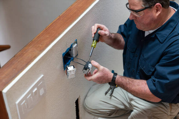 Electrician fixing outlet 3 e1676310015424