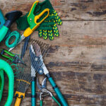 garden tools on a wooden table. view from above